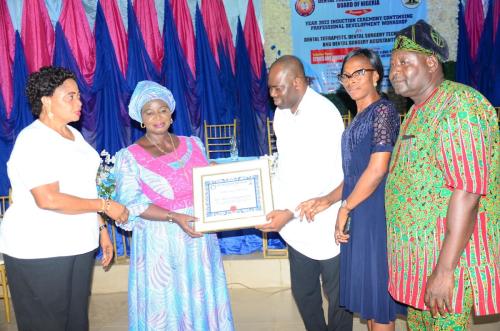 Presentation-of-honourary-certificate-to-the-Registrar-of-the-Board-during-the-year-2022-Induction-Ceremony-in-the-south-Zone-min